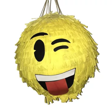 Színes Smiley pinyáta édességekkel töltve egy vidám születésnapi bulin.